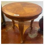 Round Wood Accent Table With Carved Legs