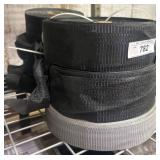 Rolls of Black and Gray Webbing Material