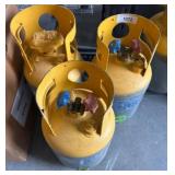 Three Yellow Propane Gas Tanks