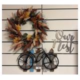 Wall Decor With Wreath, Bicycle, and Text Accent