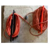 Two Orange Extension Cords on Reels