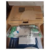 Boxed Radio Cassette, Remote, and Voltage Tester