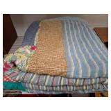 Patchwork Quilt with Striped and Floral Patterns