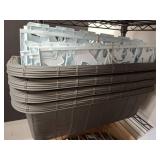 Stacked Gray Dish Racks With Plastic Separators
