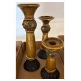 Three Gold and Black Candlesticks