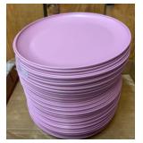 Stack of Pink Plastic Dinner Plates