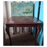 Mahogany Table and Ceramic Relief Artwork