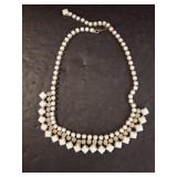 White Beaded Necklace with Geometric Accents