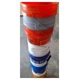 Stack of Multi-Color Plastic Utility Buckets