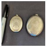 Two Silver Tone Oval Lockets