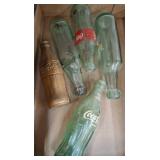 Coca-Cola Glass Bottles and One Gold