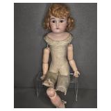 BISQUE DOLL HEAD, LEATHER BODY