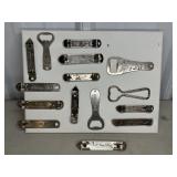 (15) BOTTLE OPENERS ON CANVAS DISPLAY