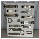 (13) BOTTLE OPENERS ON CANVAS DISPLAY