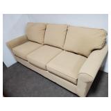 BASSETT TAN UPHOLSTERED SOFA