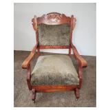 ANTIQUE UPHOLSTERED ROCKING CHAIR