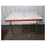 ENAMEL TABLE WITH SELF STORING LEAVES