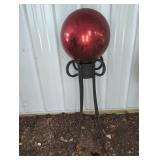 RED PAINTED METAL GAZING BALL ON STAND