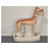 STAFFORDSHIRE GREYHOUND HOLDING RABBIT