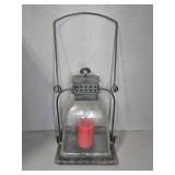 Metal and Glass Lantern With Red Candle