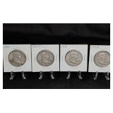 Four Franklin Half Dollar Coins