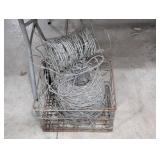 Barbed Wire Fencing Rolls in Metal Basket