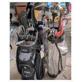 Three Golf Club Bags with Clubs
