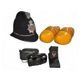 Police Helmet, Wooden Clogs, Camera, Tie