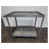 Steel utility cart with two shelves and casters