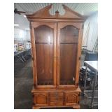 Wooden china cabinet with glass doors and drawers