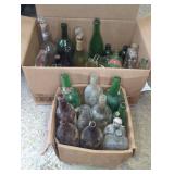 Empty Glass Bottles and Jars in Boxes