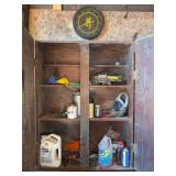 Wall Cabinet of Tools, Funnels, Oil Jug