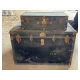 Two Black Metal Storage Trunks