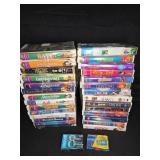 Assorted Disney VHS Tapes and 8mm Tapes