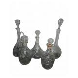Five Cut and Etched Glass Decanters