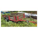 Utility Trailer With Wood Sides And Red Frame