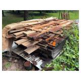 Stacked Rough Cut Lumber Planks Assorted Sizes