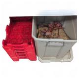 Stack Of Red Plastic Crates And Bin With Metal
