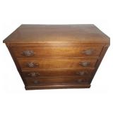 Wooden Dresser With Four Drawers And Ornate Pulls