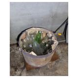 BASKET FULL OF VINTAGE GLASS BOTTLES