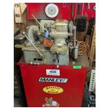 VALVE FACE GRINDING MACHINE WITH ROLLING CABINET