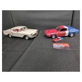 Two Diecast Model Cars With Accessories