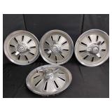Four Vintage Car Hubcaps