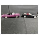 Two Diecast Model Cars in Purple and Black