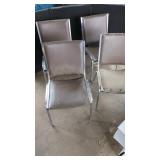 Four Metal Frame Stackable Chairs