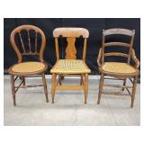 THREE WOODEN CHAIRS WITH CANE SEATS