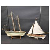 TWO WOODEN SAILBOAT MODELS ON STANDS