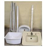 THREE SINKS WITH MIXED PLUMBING PIPES