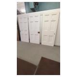 THREE WHITE WOOD INTERIOR DOORS 4-6 PANEL