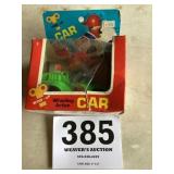 Wind up whistling action car